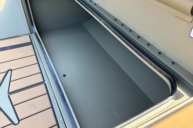 Slide: The Image of Storage compartment of 2027 Tracker Grizzly 1553 Timber boat, featuring durable interior design. - 19