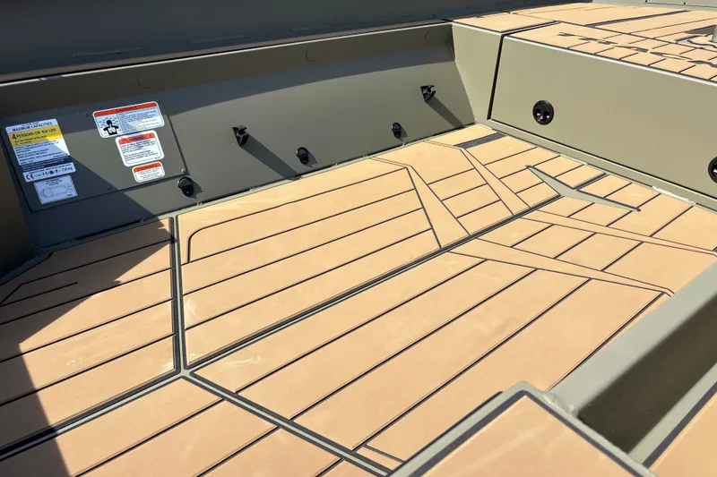 Slide: The Image of 2027 Tracker Grizzly 1553 Timber boat interior with tan non-slip flooring. - 15
