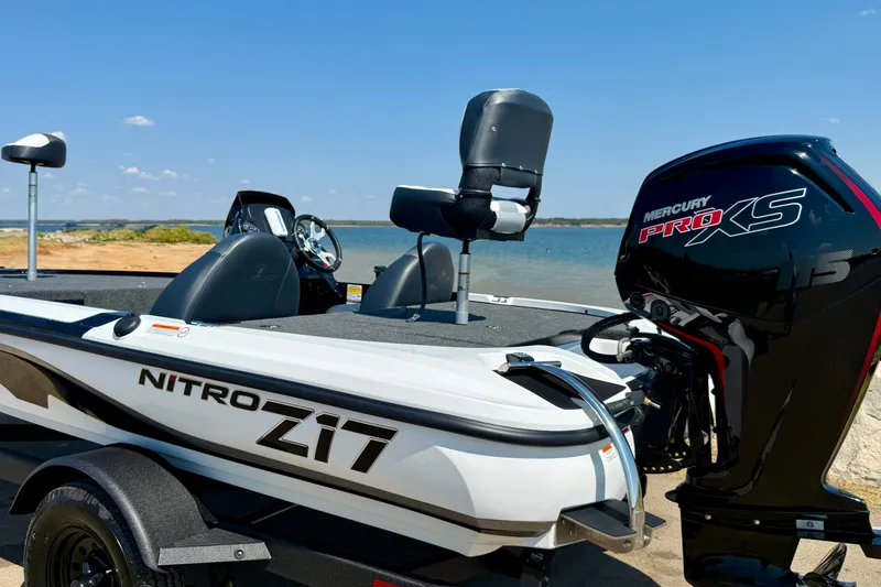 Slide: The Image of Nitro Z17 boat with Mercury Pro XS engine by a lake, 2027 model. - 18