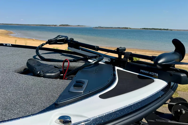 Slide: The Image of Nitro Z17 2027 boat with Minn Kota Edge motor by a serene lake. - 5