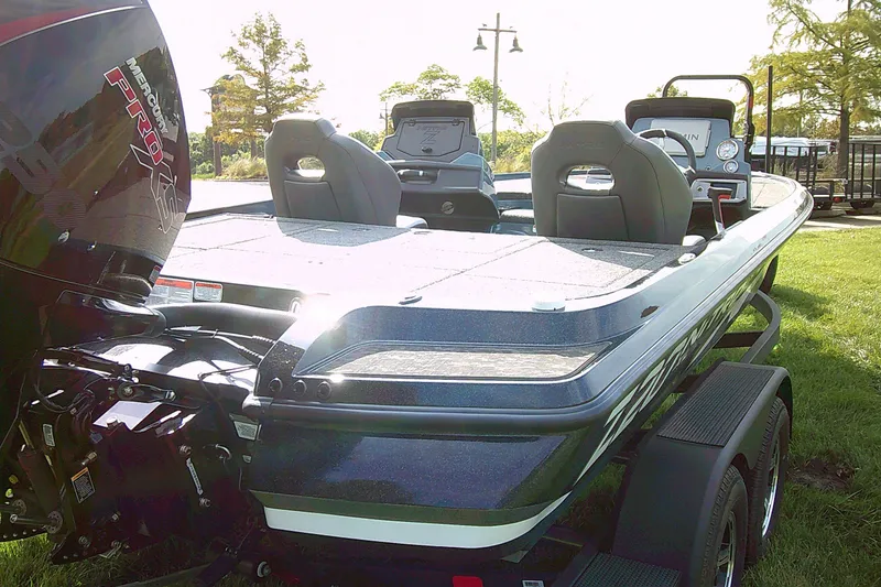 Slide: The Image of 2025 Nitro Z20 XL Pro bass boat with Mercury Pro XS engine on grassy area. - 6