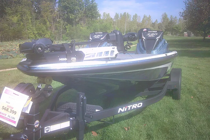 Slide: The Image of 2025 Nitro Z20 XL Pro boat on trailer, displayed outdoors with sale price tag. - 5