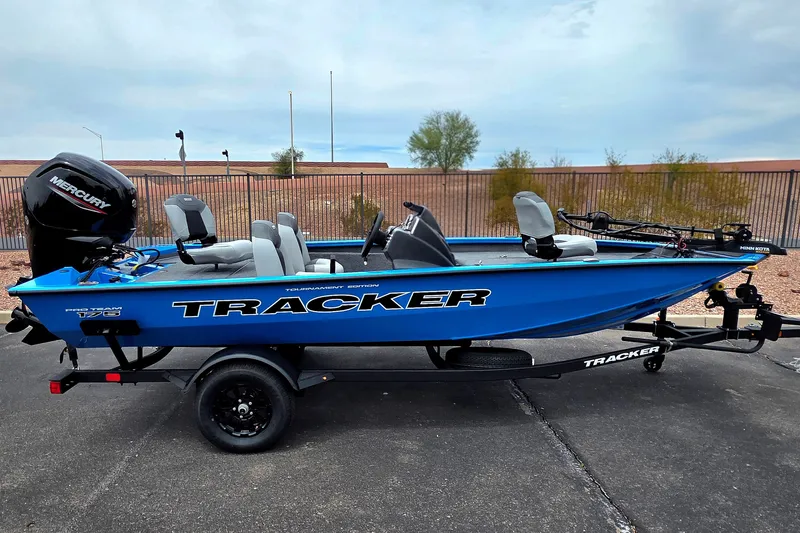 The Image of 2027 Tracker Pro Team 175 boat in blue, on trailer, with Mercury engine. - 0