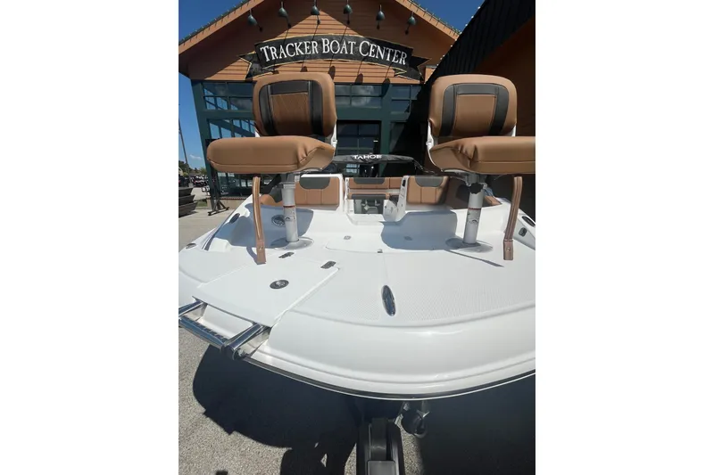 Slide: The Image of 2027 Tahoe 1950 boat at Tracker Boat Center, featuring dual seats and sleek design. - 2