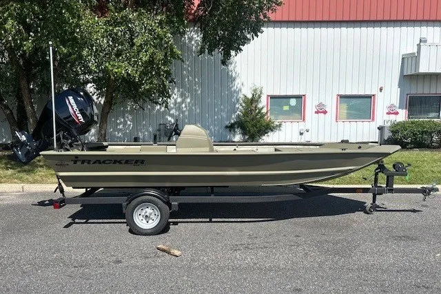 The Image of 2027 Tracker Grizzly 1648 SC boat on trailer, parked outdoors. - 0