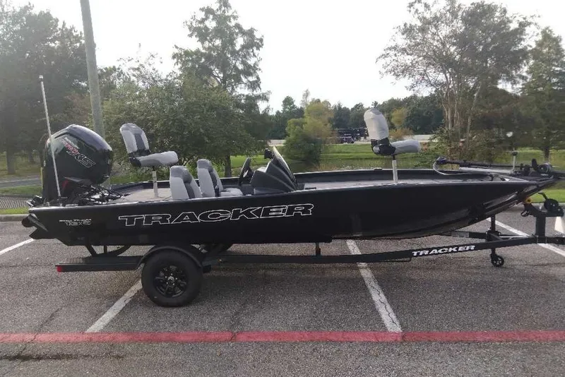 The Image of 2027 Tracker Pro Team 190 boat on trailer in parking lot. - 0
