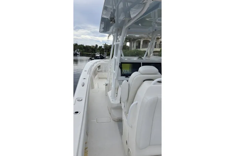 Slide: The Image of 2018 Invincible 39 Open Fisherman boat with sleek white interior and spacious deck. - 23