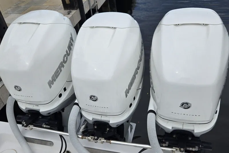 Slide: The Image of Triple Mercury outboard engines on a 2018 Invincible 39 Open Fisherman boat. - 31