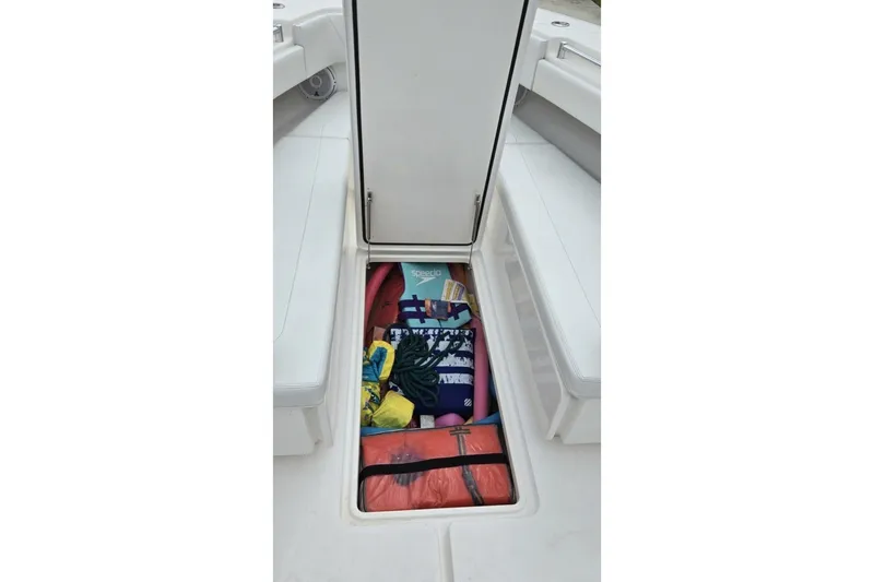 Slide: The Image of Storage compartment on 2018 Invincible 39 Open Fisherman boat, filled with gear. - 24