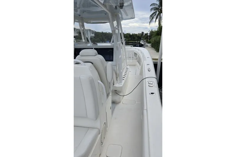 Slide: The Image of 2018 Invincible 39 Open Fisherman boat interior with white seating and helm station. - 22