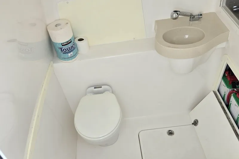 Slide: The Image of Compact bathroom in 2018 Invincible 39 Open Fisherman boat with toilet and sink. - 32
