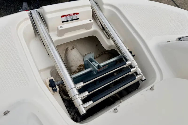 Slide: The Image of 2006 Chaparral Sunesta 216 boat ladder and anchor storage compartment. - 71