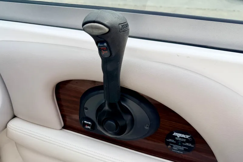 Slide: The Image of Throttle control lever on a 2006 Chaparral Sunesta 216 boat interior. - 53