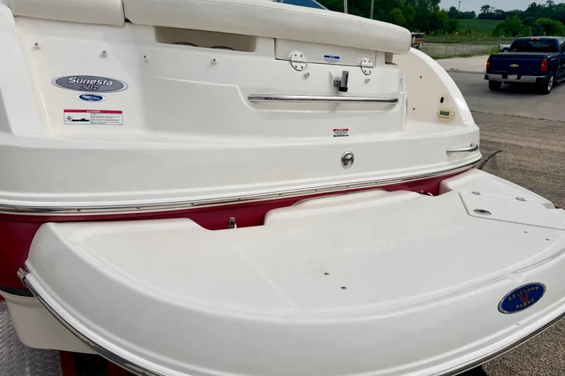 Slide: The Image of 2006 Chaparral Sunesta 216 boat rear view with swim platform and branding. - 19