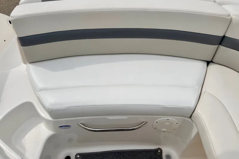 Slide: The Image of 2006 Chaparral Sunesta 216 boat seating with white and gray upholstery. - 35