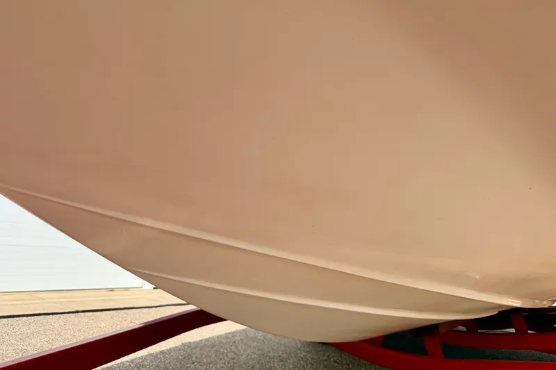 Slide: The Image of Close-up of 2006 Chaparral Sunesta 216 boat hull on a red trailer. - 86