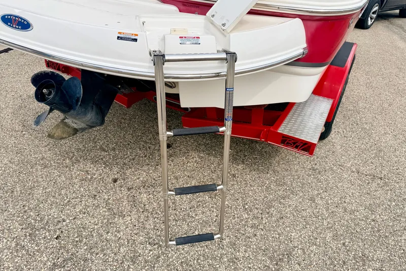 Slide: The Image of Rear view of 2006 Chaparral Sunesta 216 boat with ladder and trailer. - 21