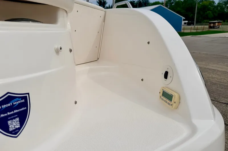 Slide: The Image of 2006 Chaparral Sunesta 216 boat deck with control panel and marine sticker. - 22