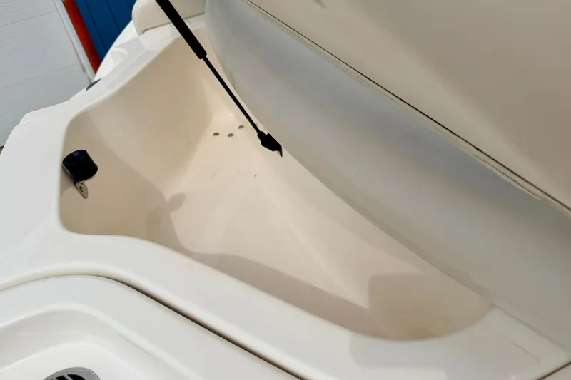 Slide: The Image of Storage compartment of a 2006 Chaparral Sunesta 216 boat, open and empty. - 28