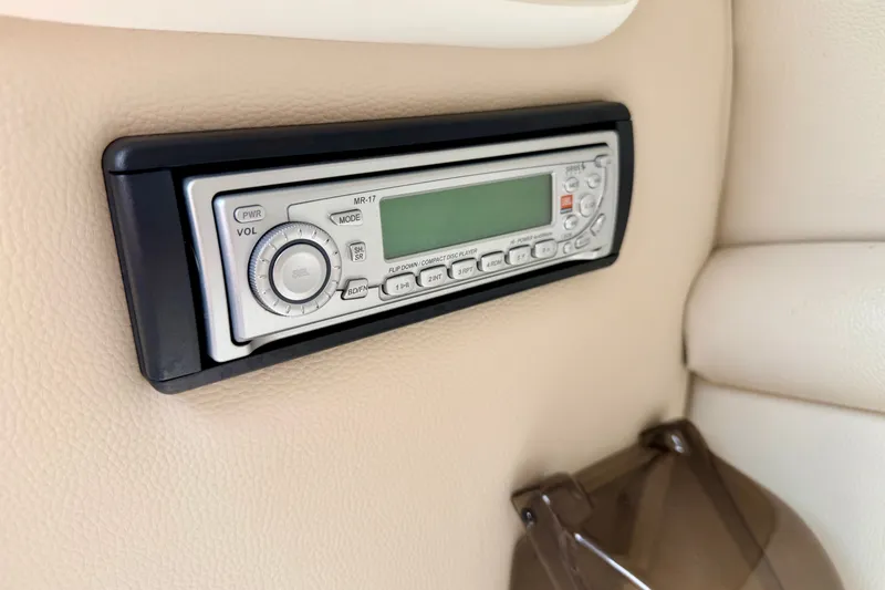 Slide: The Image of 2006 Chaparral Sunesta 216 boat stereo system, featuring a sleek control panel. - 45