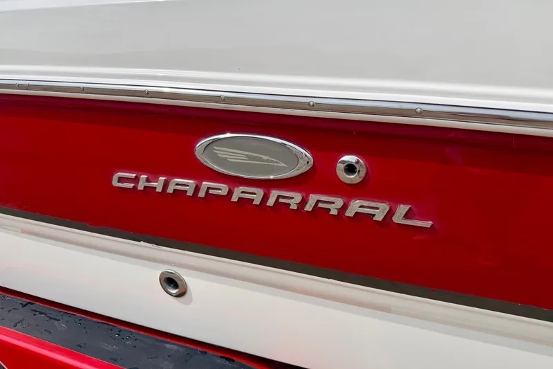 Slide: The Image of 2006 Chaparral Sunesta 216 boat with red and white exterior detailing. - 9
