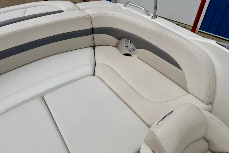 Slide: The Image of 2006 Chaparral Sunesta 216 boat interior with white and gray seating. - 80