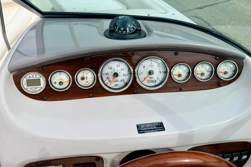 Slide: The Image of Dashboard of 2006 Chaparral Sunesta 216 boat with gauges and compass. - 50