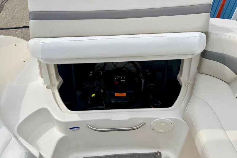 Slide: The Image of 2006 Chaparral Sunesta 216 boat interior showing engine compartment under seating. - 36