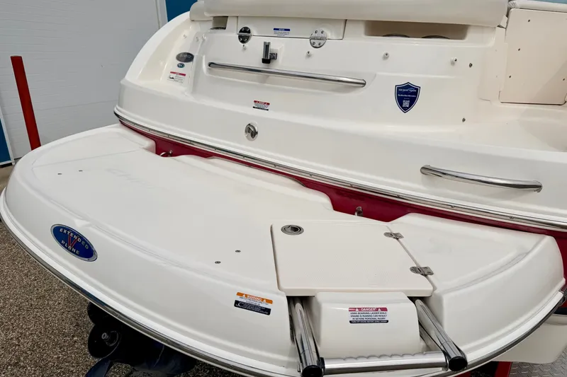 Slide: The Image of 2006 Chaparral Sunesta 216 boat with extended swim platform and stainless steel handles. - 18