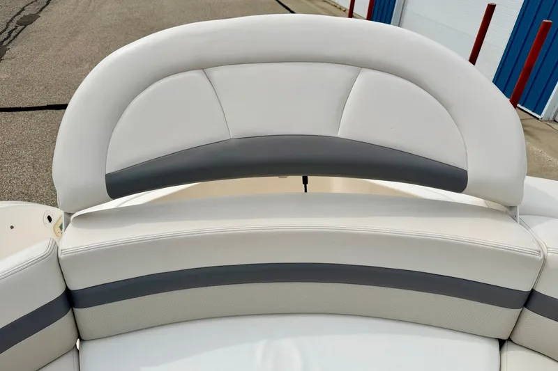 Slide: The Image of 2006 Chaparral Sunesta 216 boat seating with white and gray upholstery. - 27