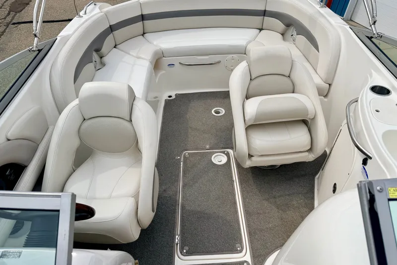 Slide: The Image of 2006 Chaparral Sunesta 216 boat interior with white seating and gray carpet. - 57