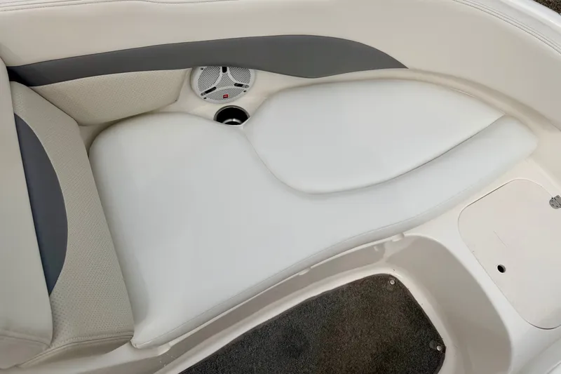 Slide: The Image of 2006 Chaparral Sunesta 216 boat interior seating with speaker and cup holder. - 64