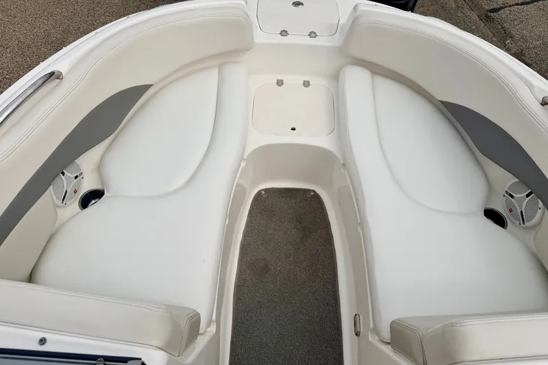 Slide: The Image of 2006 Chaparral Sunesta 216 boat interior with white seating and speakers. - 63