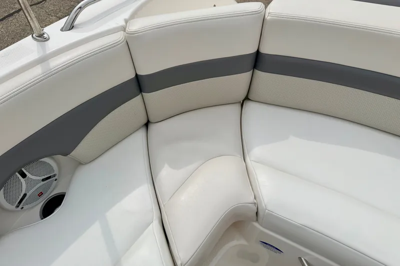 Slide: The Image of 2006 Chaparral Sunesta 216 boat interior with white and gray seating. - 32