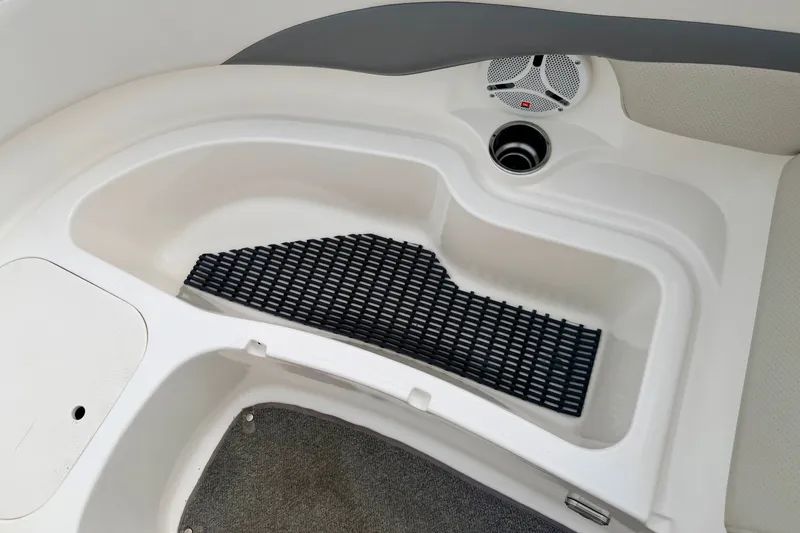 Slide: The Image of 2006 Chaparral Sunesta 216 boat interior with storage compartment and speaker. - 67