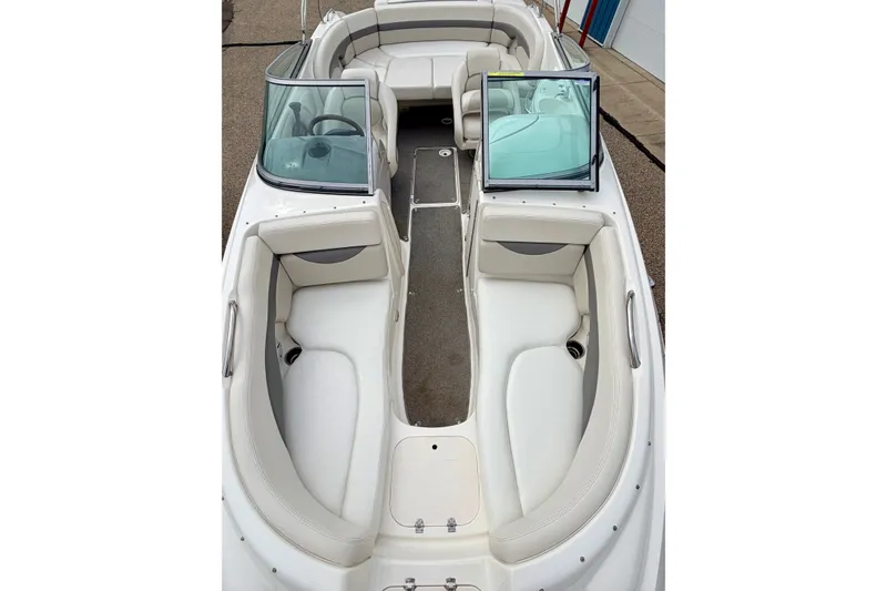 Slide: The Image of 2006 Chaparral Sunesta 216 boat interior with white seating and open windshield. - 72