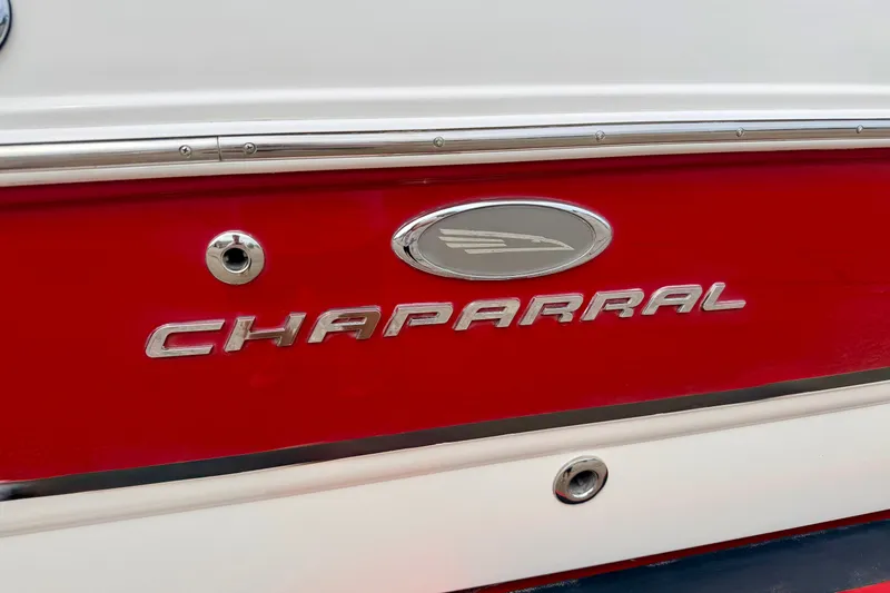 Slide: The Image of 2006 Chaparral Sunesta 216 boat with red and white exterior detailing. - 15