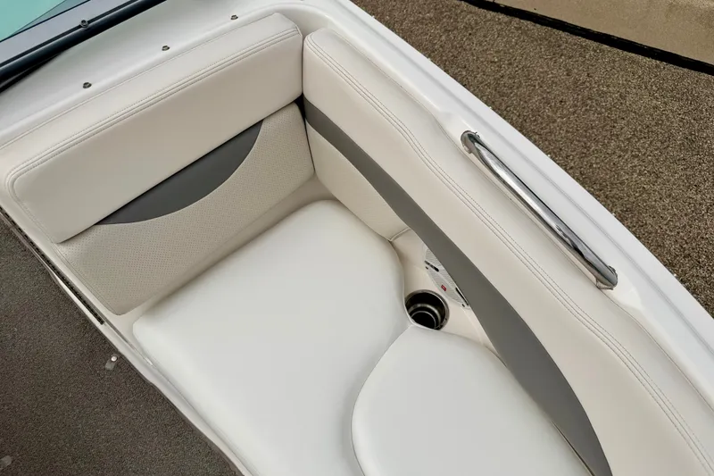 Slide: The Image of 2006 Chaparral Sunesta 216 boat interior with white and gray cushioned seating. - 74