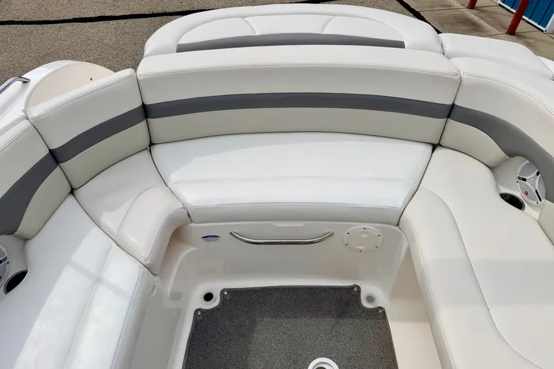 Slide: The Image of 2006 Chaparral Sunesta 216 boat interior with white and gray seating. - 24