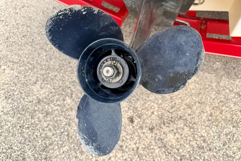 Slide: The Image of Close-up of a 2006 Chaparral Sunesta 216 boat propeller on a textured surface. - 23