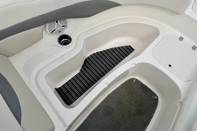 Slide: The Image of 2006 Chaparral Sunesta 216 boat interior with speaker, cup holder, and storage area. - 65