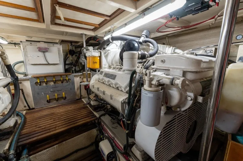 Slide: The Image of Engine room of 1998 Grand Banks 46 Classic yacht, featuring a Caterpillar engine. - 66