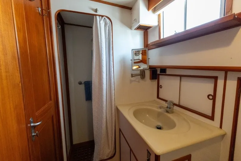 Slide: The Image of Bathroom interior of 1998 Grand Banks 46 Classic yacht, featuring sink and shower. - 39