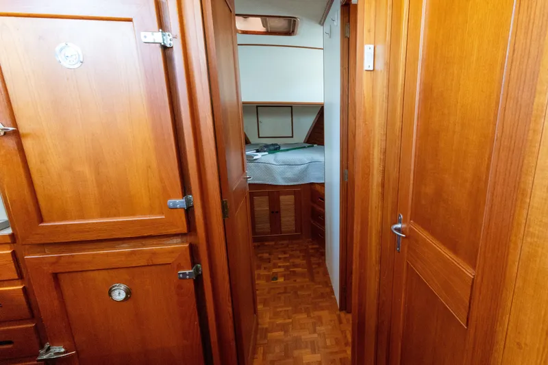 Slide: The Image of Interior of 1998 Grand Banks 46 Classic yacht with wooden cabinetry and cozy bedroom. - 33