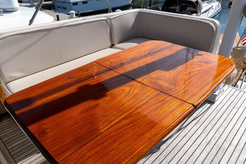 Slide: The Image of Polished wooden table on 1998 Grand Banks 46 Classic yacht deck. - 70