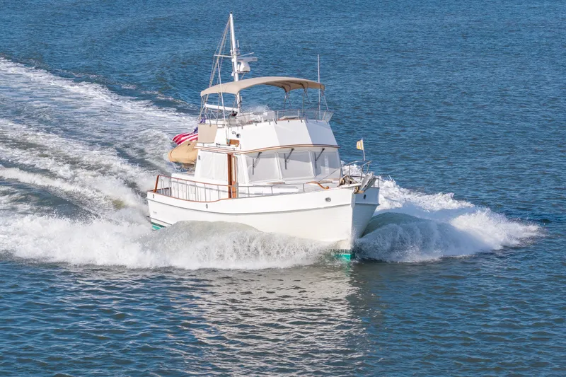 Slide: The Image of Grand Banks 46 Classic yacht cruising on open water, 1998 model. - 106