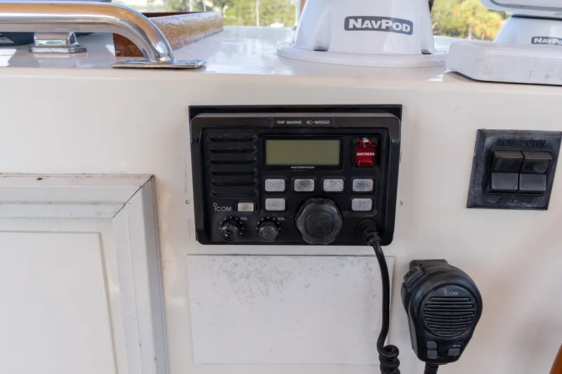 Slide: The Image of VHF marine radio on 1998 Grand Banks 46 Classic yacht dashboard with NavPod equipment. - 80