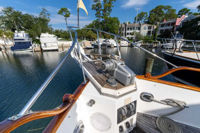 Slide: The Image of Bow view of 1998 Grand Banks 46 Classic yacht docked in a marina. - 89