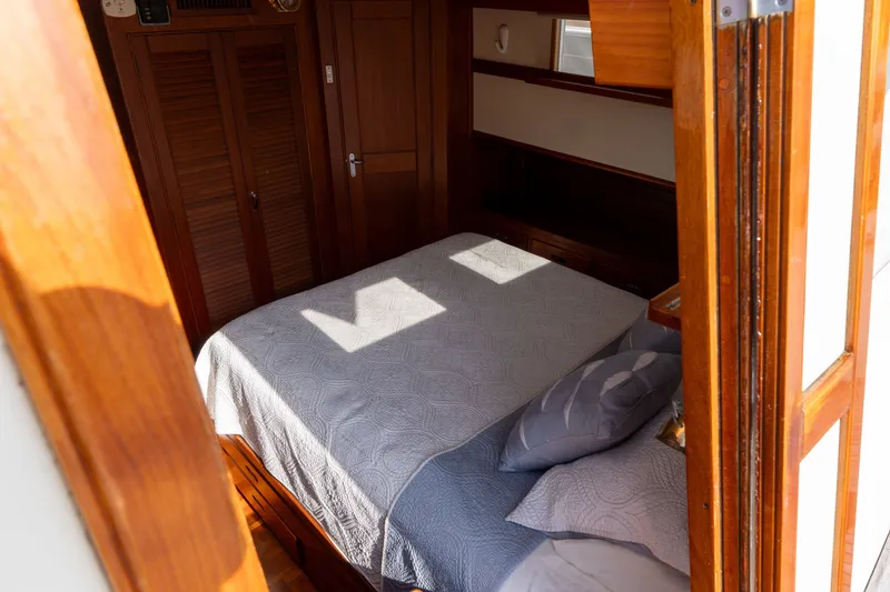 Slide: The Image of Cozy cabin interior of 1998 Grand Banks 46 Classic yacht with wooden finishes. - 45