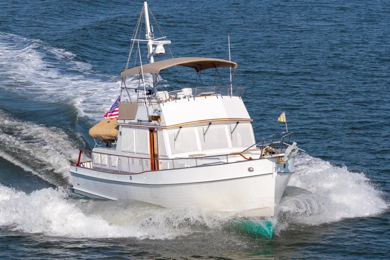 Slide: The Image of Grand Banks 46 Classic yacht cruising on open water, 1998 model. - 1